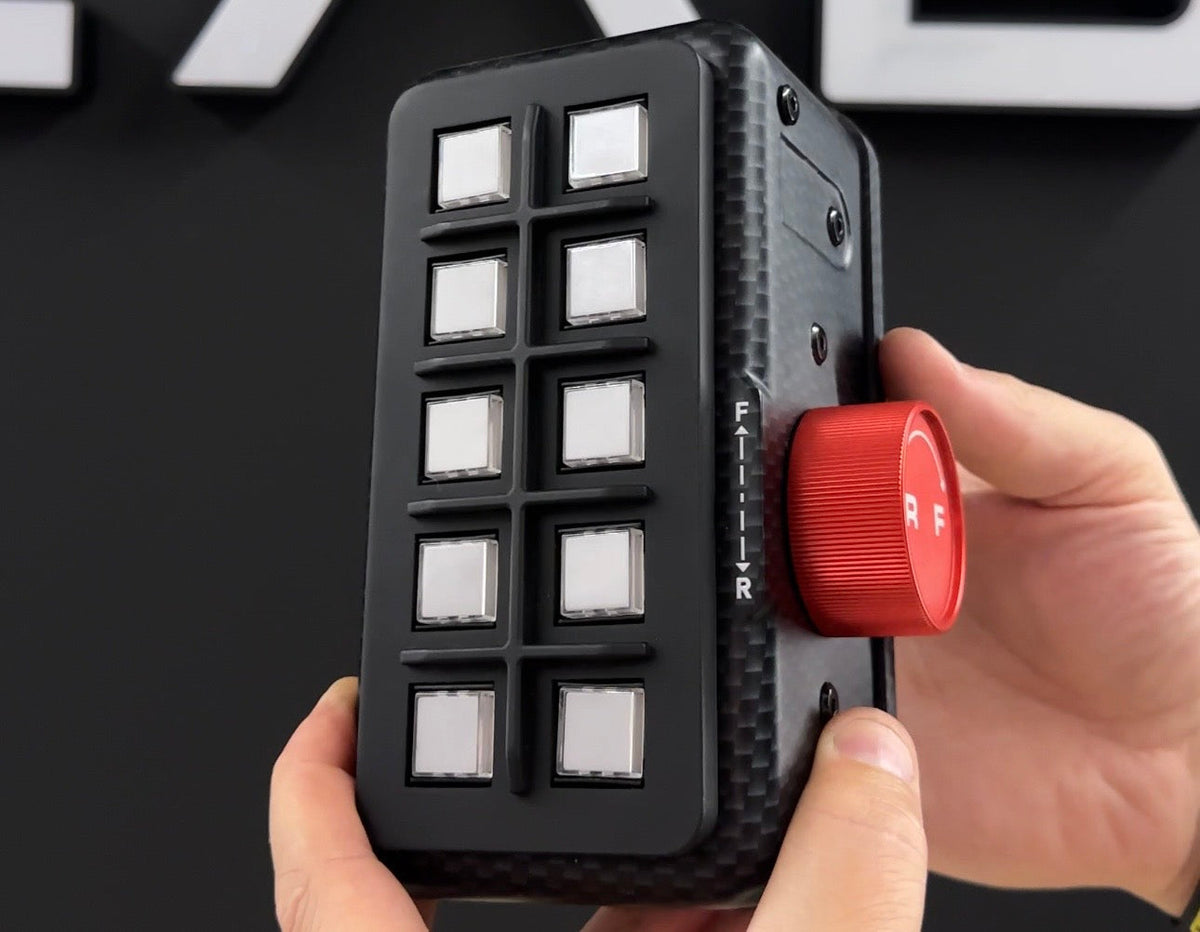Hands holding the EPLAB BB2.1 CUP with illuminated buttons and red brake bias knob