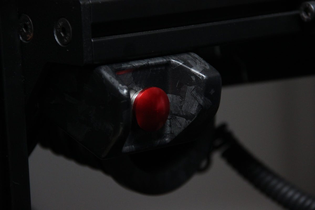 Close-up of the EPLAB Start Button red button and carbon-look housing